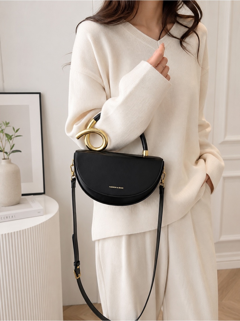 Black Half-Moon Shoulder Bag with Gold Sculptural Handle